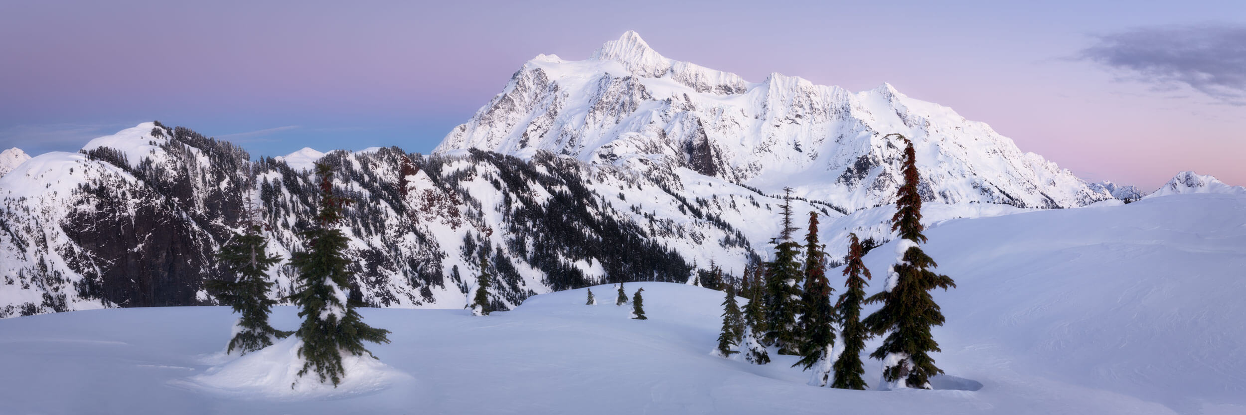 An Artist Point snowshoe picture shows Mount Shuksan at sunset.