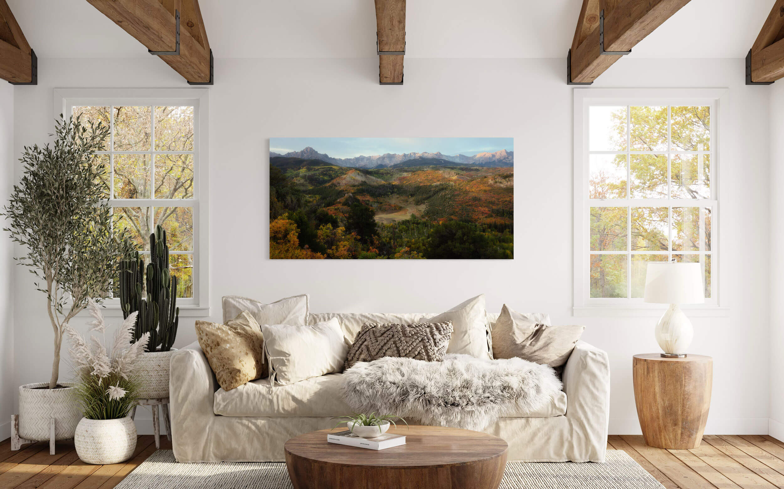 A Colorado fall picture of Mount Sneffels near Ridgway hangs in a living room.