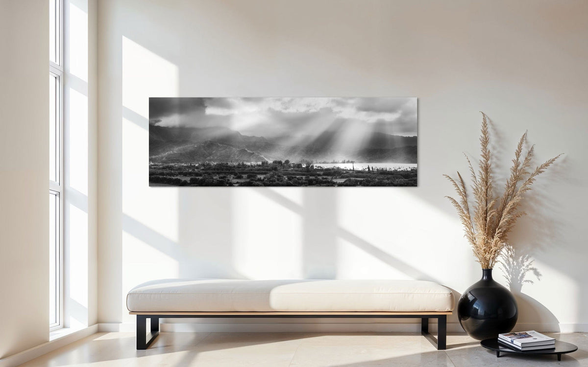 A piece of Hanalei black and white Kauai art hangs in an entryway.