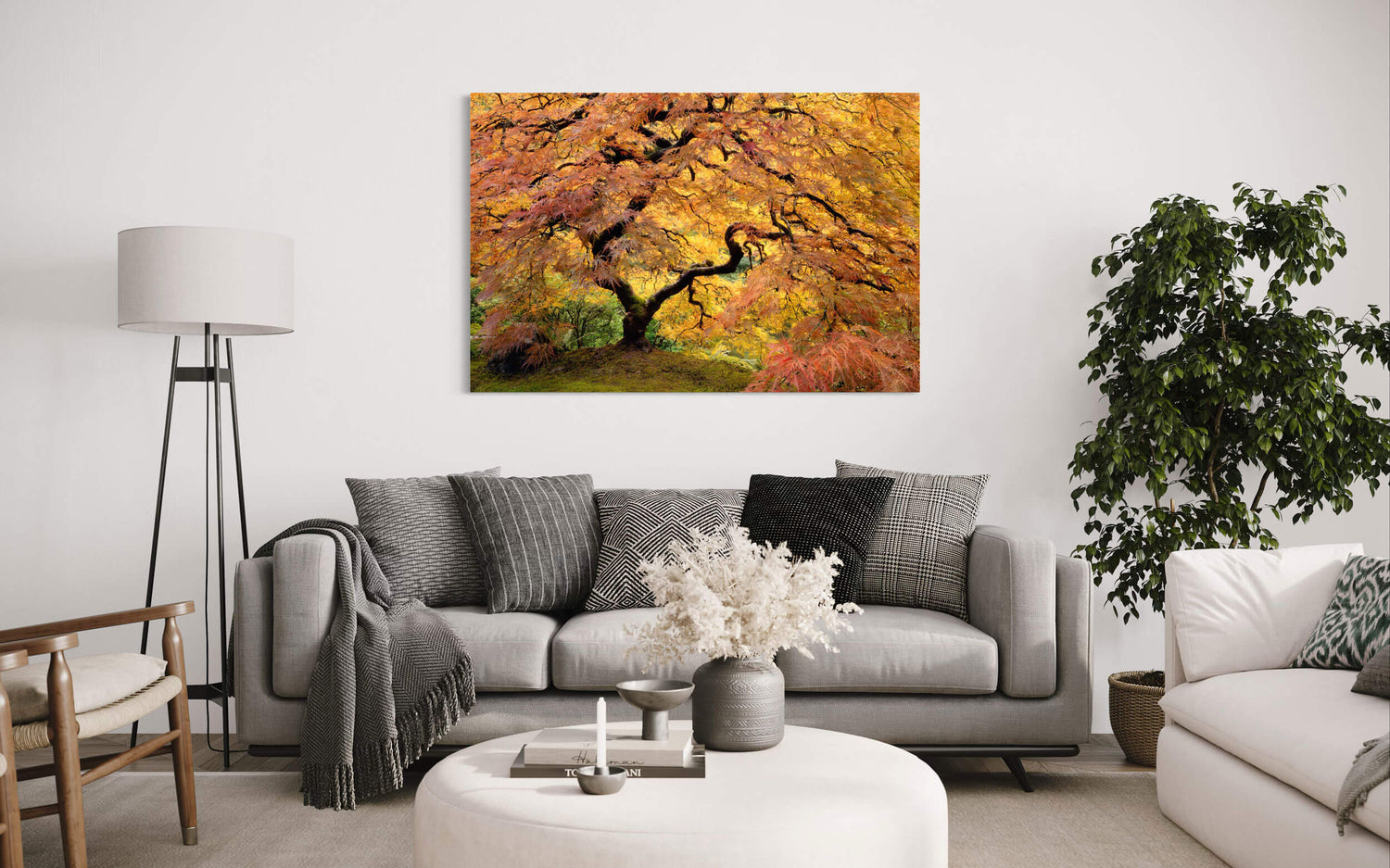 A piece of japanese garden art showing the Portland maple hangs in a living room.