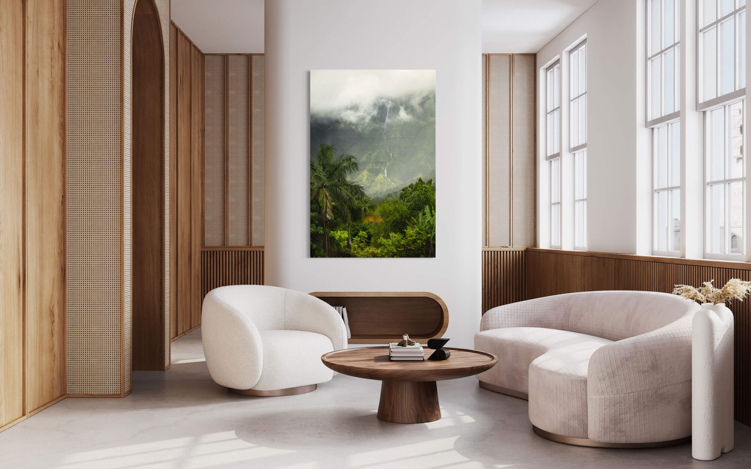 A piece of Kauai art showing a waterfall picture outside of Hanalei hangs in a living room.