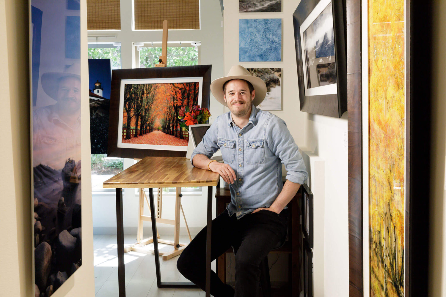Lars Gesing in his Seattle photography gallery showcasing his nature photography prints for sale.