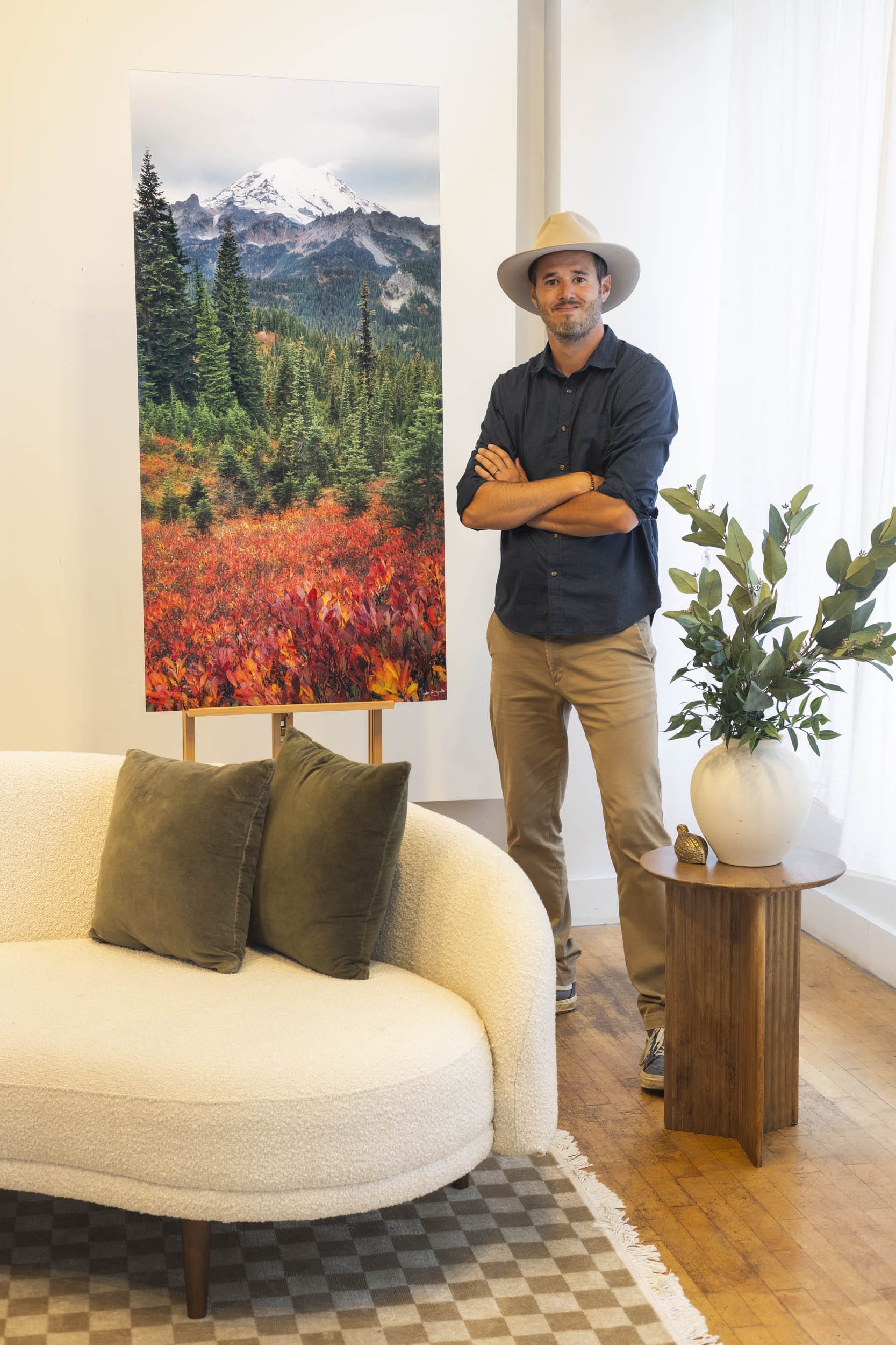 West Seattle artist Lars Gesing with his Mount Rainier artwork RAINIER RHAPSODY.
