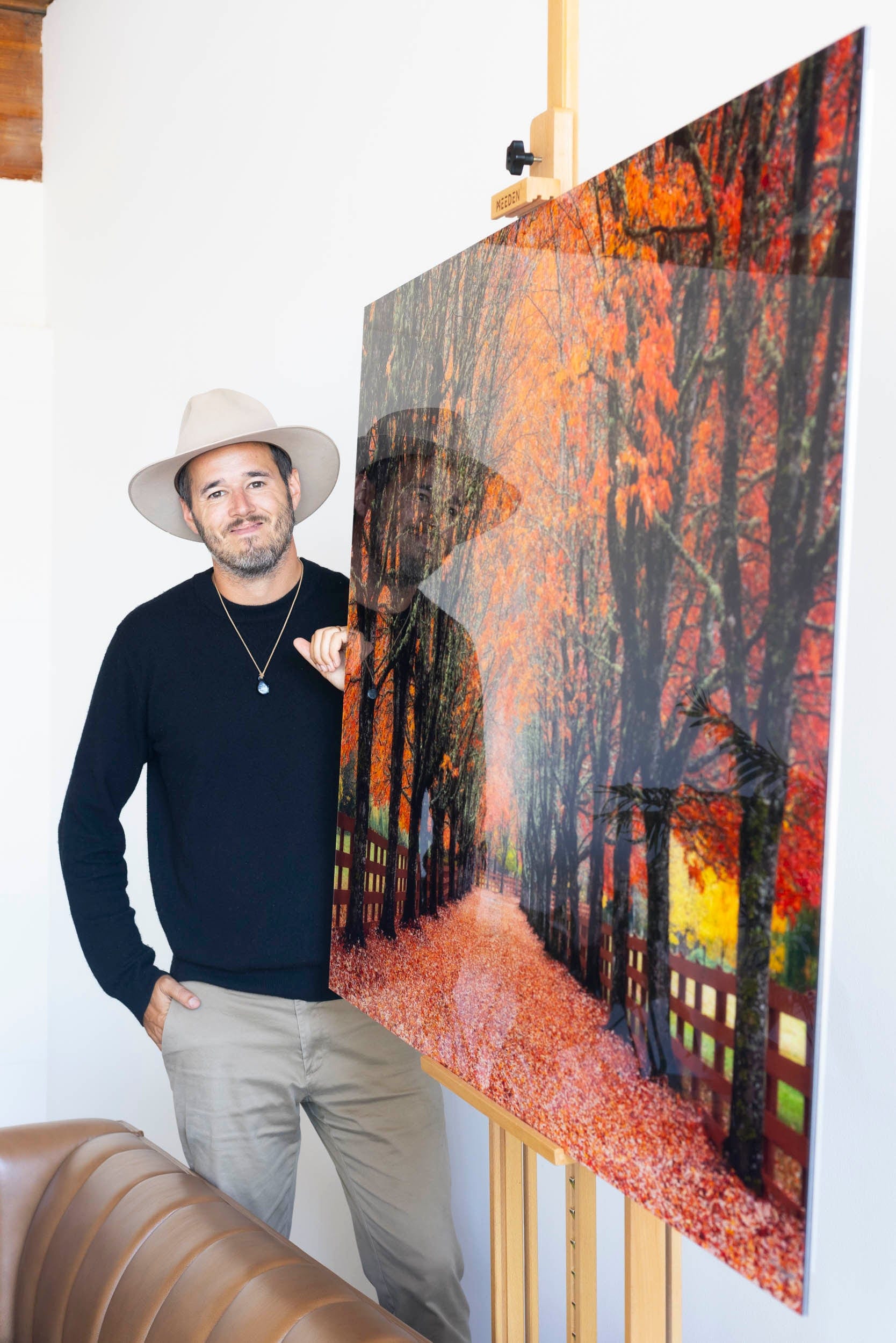 West Seattle artist Lars Gesing with his fine art photograph of the fall colors at Rockwood Farm.