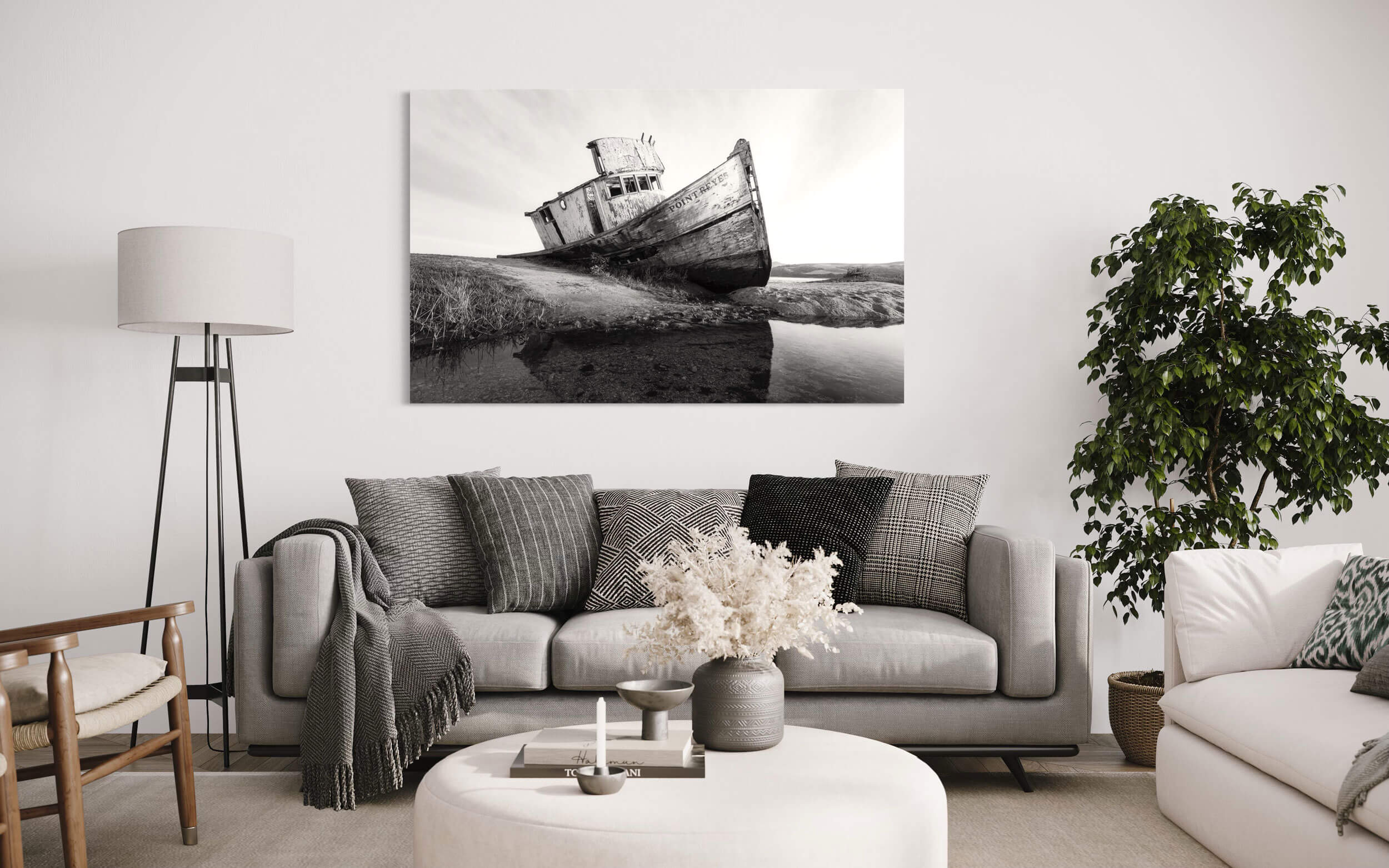 A piece of San Francisco art showing a Point Reyes picture hangs in a living room.