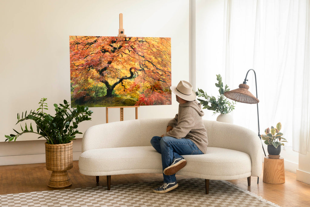 West Seattle artist Lars Gesing with his Japanese Maple photograph Guardian Angel, a popular piece of living room wall art.