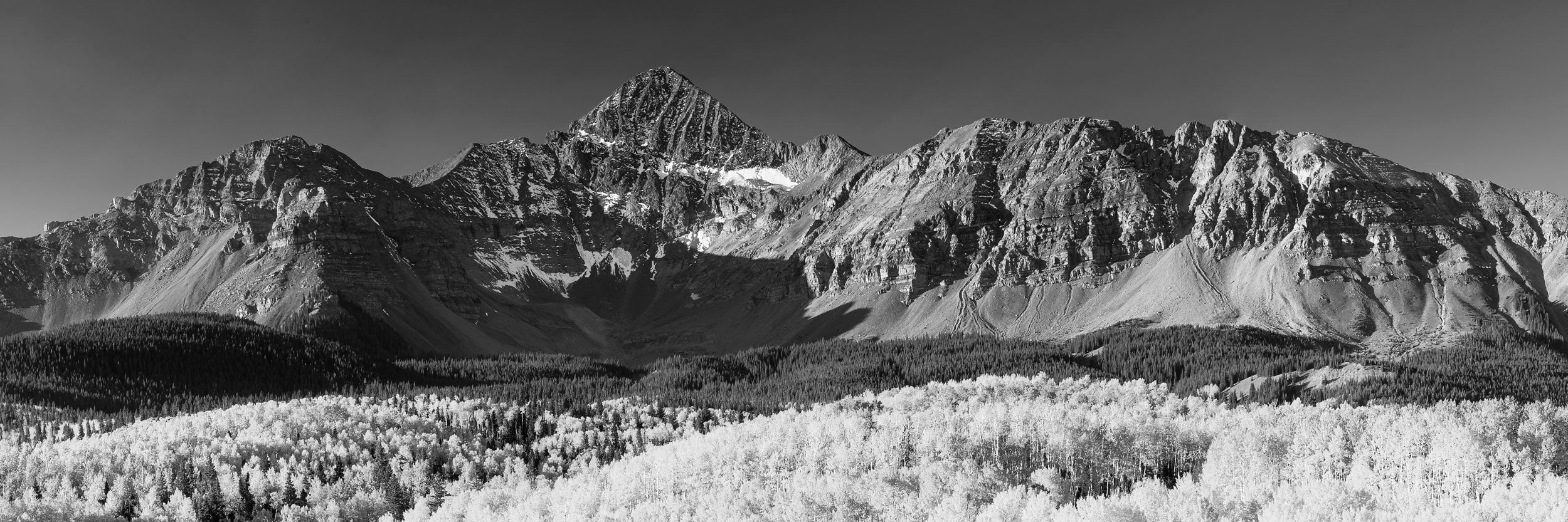 A fine art nature photograph of Mt. Wilson, the mountain that is on the Coors can, near Telluride, Colorado, during peak fall, but in black and white.