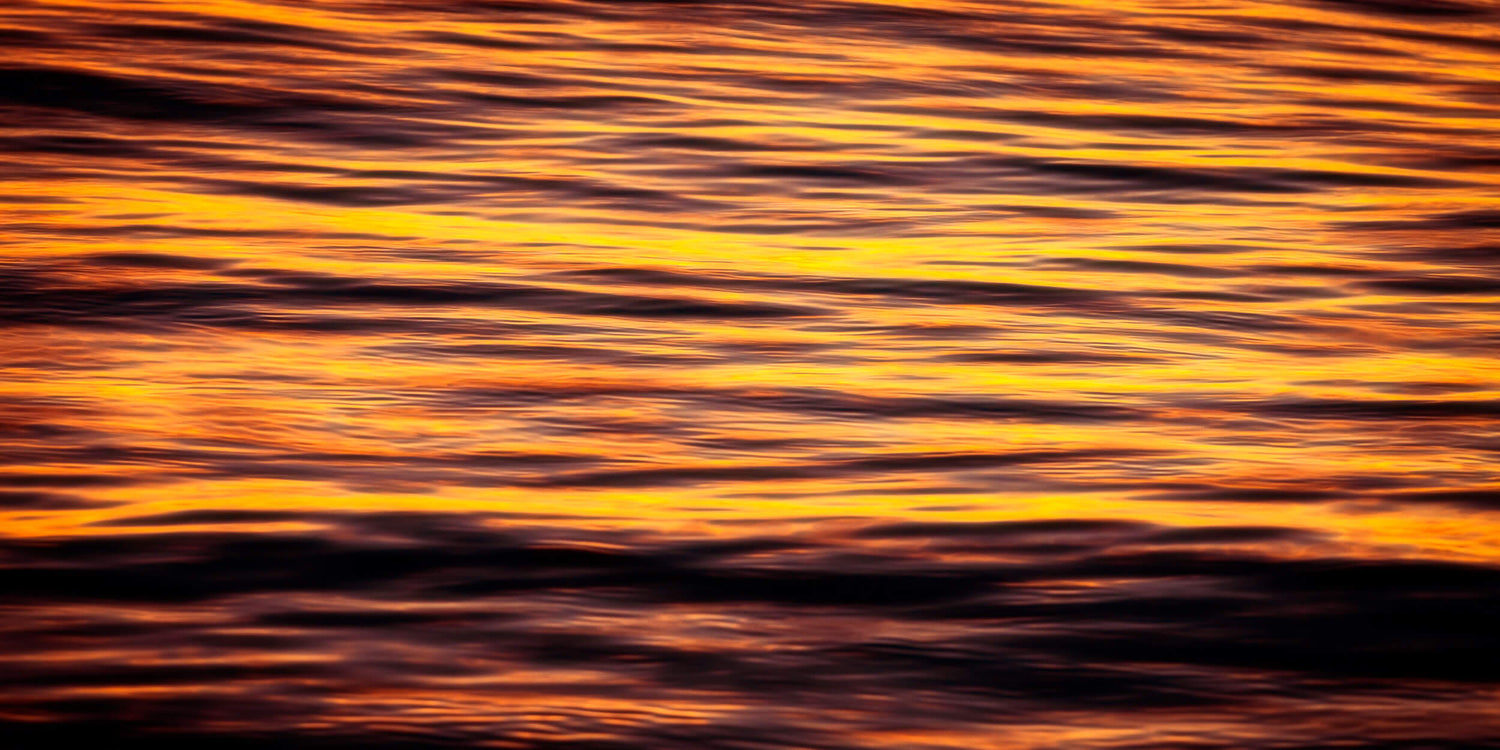 A Key West sunset picture shows the colors reflected on the water of one of the best beaches to watch.