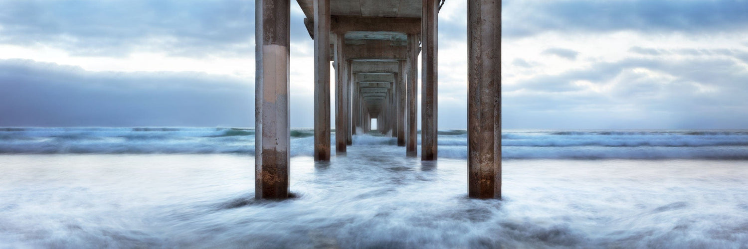 This piece of beach decor for bathroom spaces shows a photo of the La Jolla Pier.