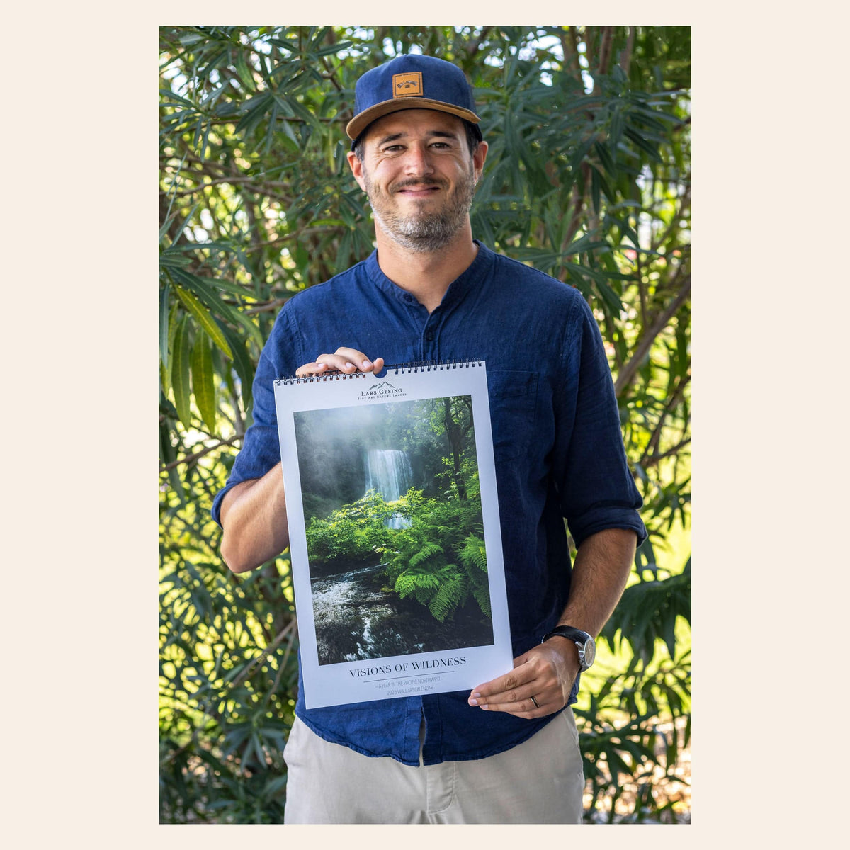 West Seattle artist Lars Gesing with his 2026 PNW wall art calendar.