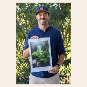 West Seattle artist Lars Gesing with his 2026 PNW wall art calendar.