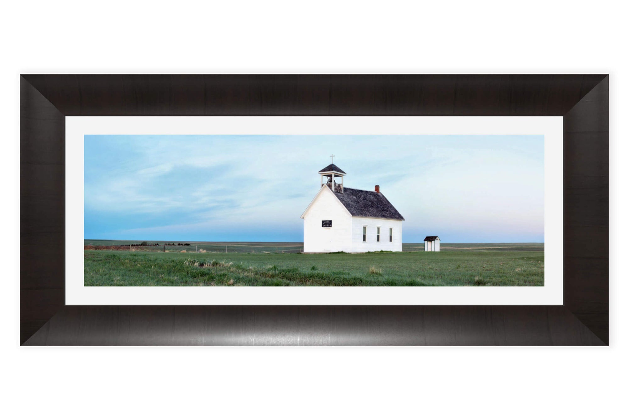 A framed picture of the Abbott Church near Lindon, part of Colorado settler history.