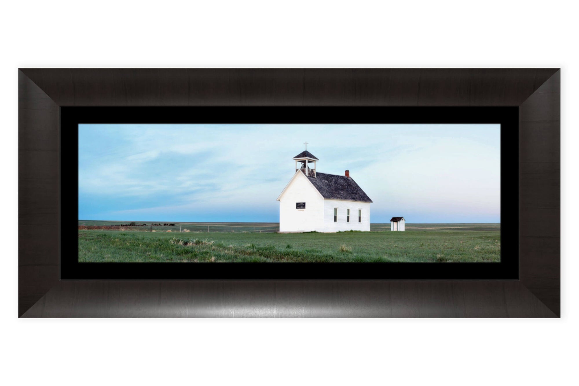 A framed picture of the Abbott Church near Lindon, part of Colorado settler history.