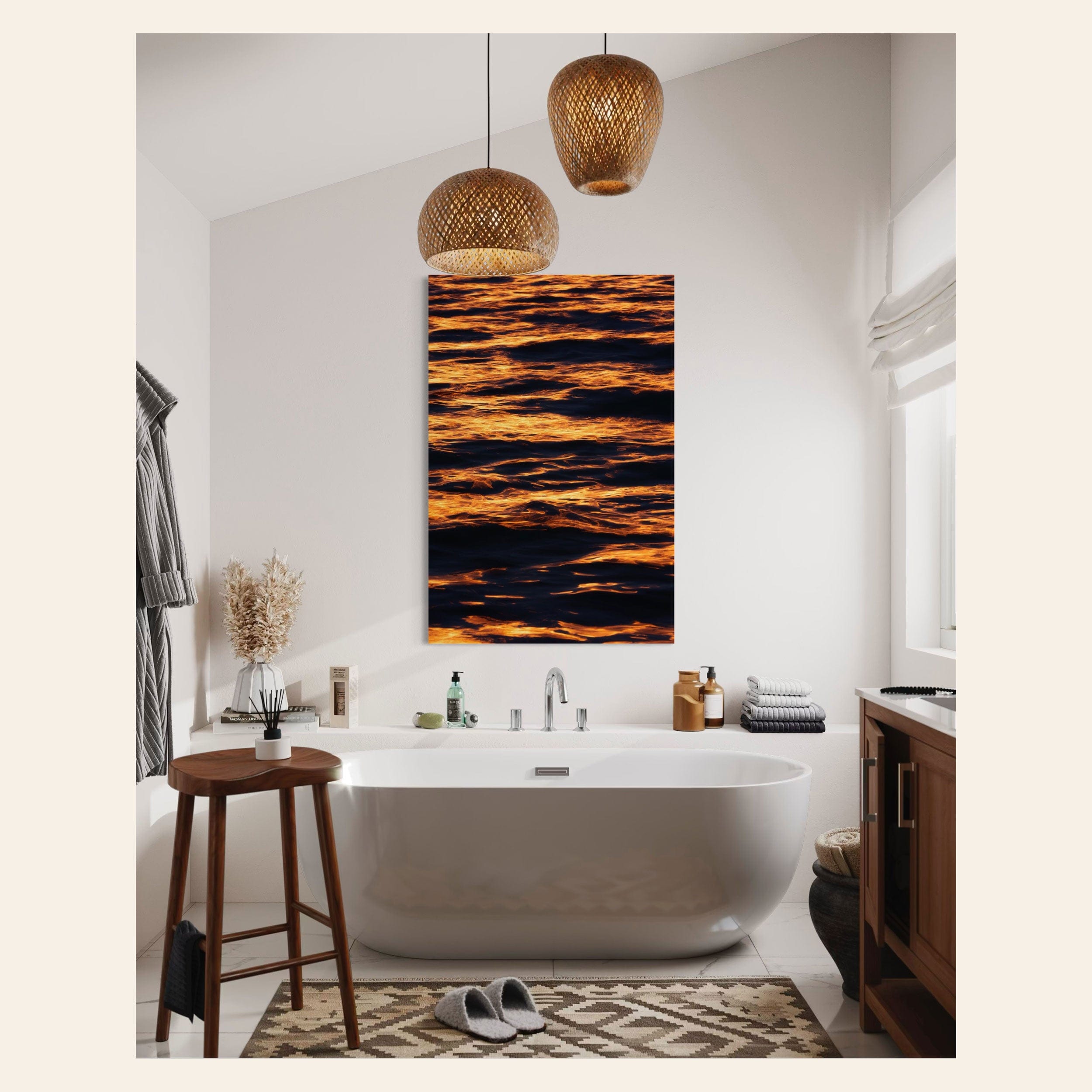 A piece of West Seattle wall art showing a sunset reflected on the Puget Sound at Alki Beach hangs in a bathroom.