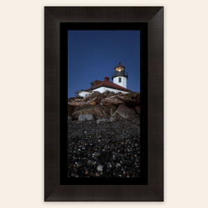 A piece of framed West Seattle wall art shows the Alki Lighthouse.