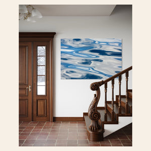 A piece of Anacortes art showing the abstract water surface on a whale watching tour hangs in an entryway.