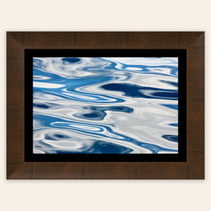 A piece of framed Anacortes art shows the abstract water surface on a whale watching tour.