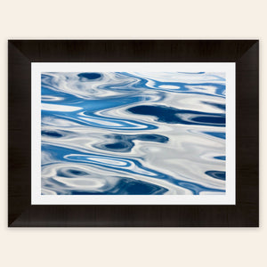 A piece of framed Anacortes art shows the abstract water surface on a whale watching tour.