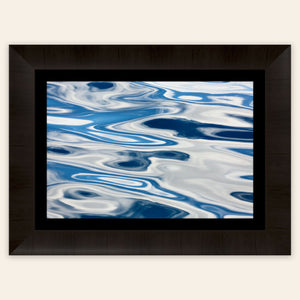 A piece of framed Anacortes art shows the abstract water surface on a whale watching tour.