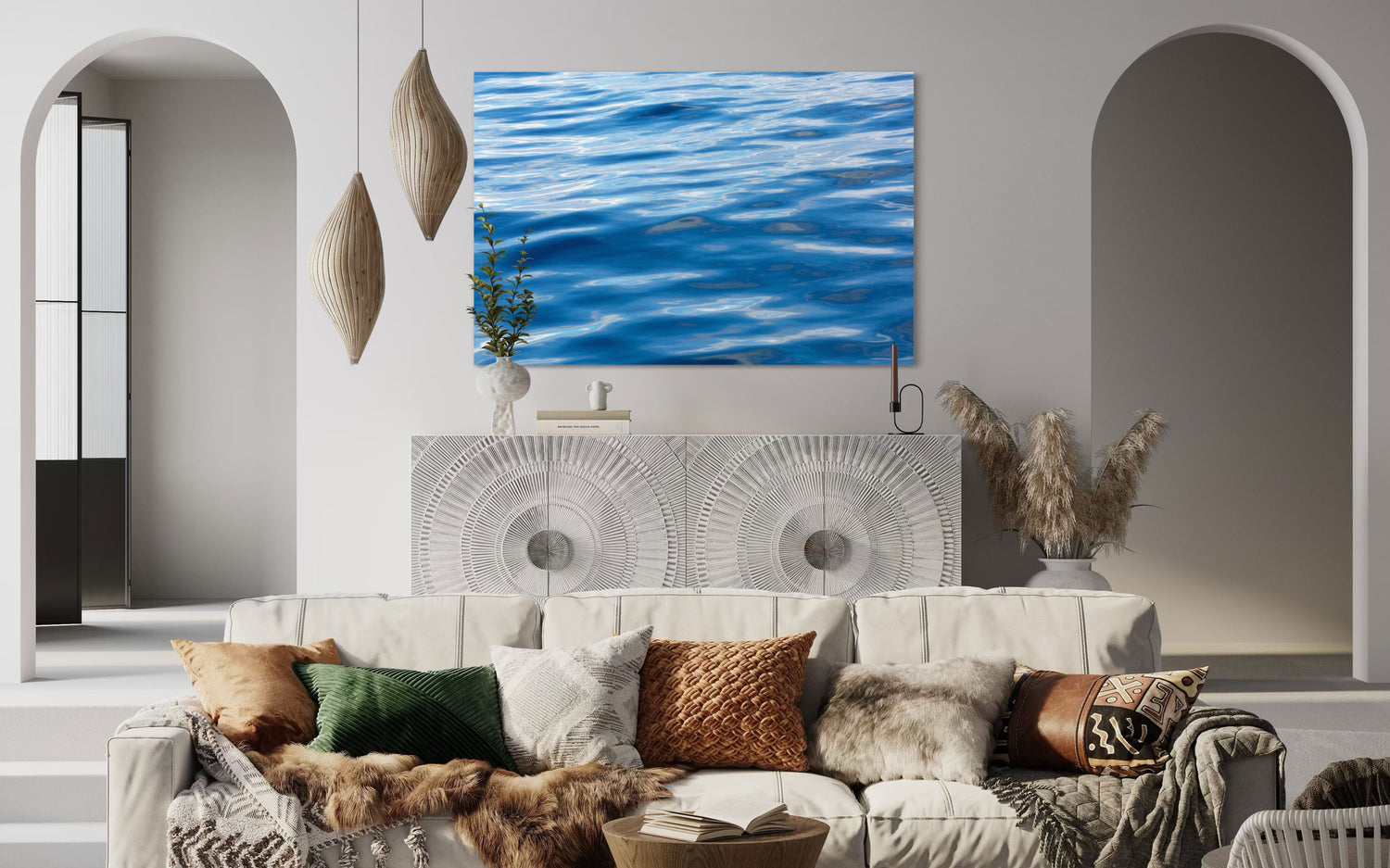 A piece of Anacortes art showing a photo of the water, as seen from aboard a whale watching boat tour, hangs in a living room.