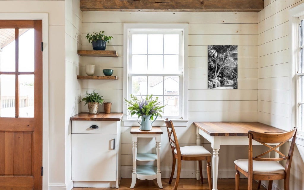 A piece of black and white Kauai art showing Anini Road hangs on a kitchen wall.