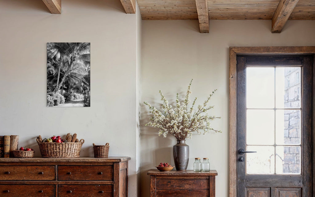 A piece of black and white Kauai art showing Anini Road hangs in an entryway space.