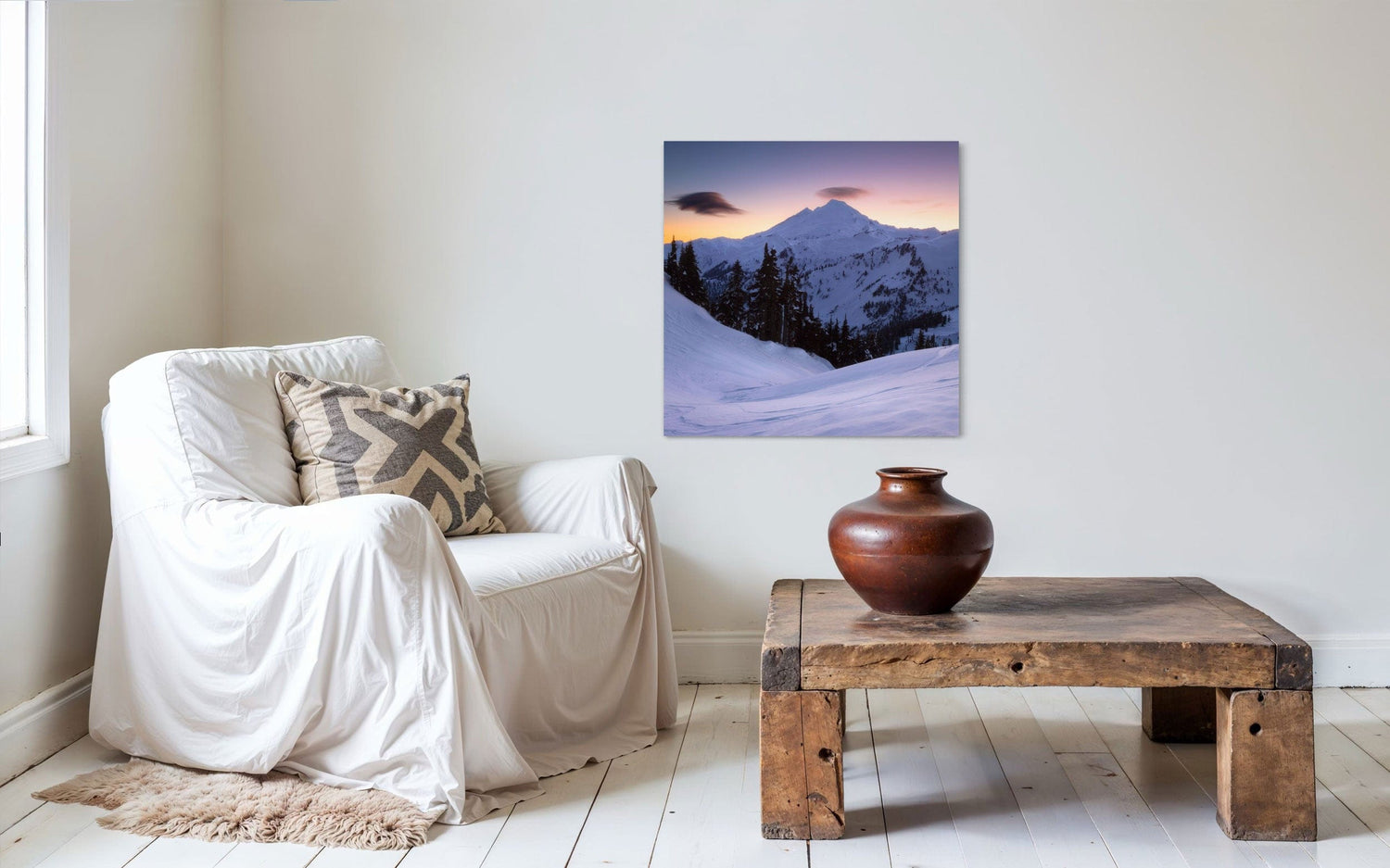 A piece of Pacific Northwest art showing a Mount Baker photo hangs in a sitting area.