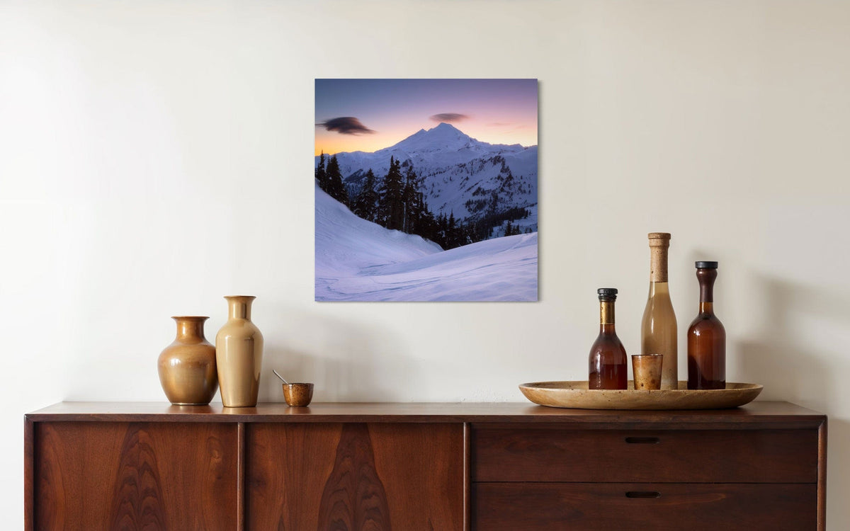 A piece of Pacific Northwest art showing a Mount Baker photo hangs over a console.