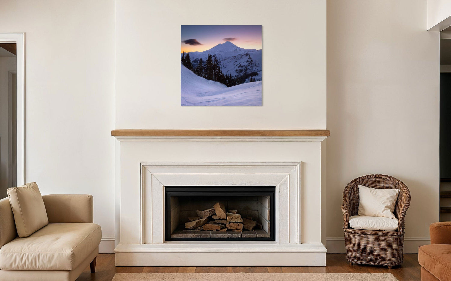 A piece of Pacific Northwest art showing a Mount Baker photo hangs over a fireplace.