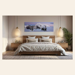 A piece of Washington wall art showing the view from Artist Point at Mount Baker toward Mount Shuksan hangs in a bedroom.