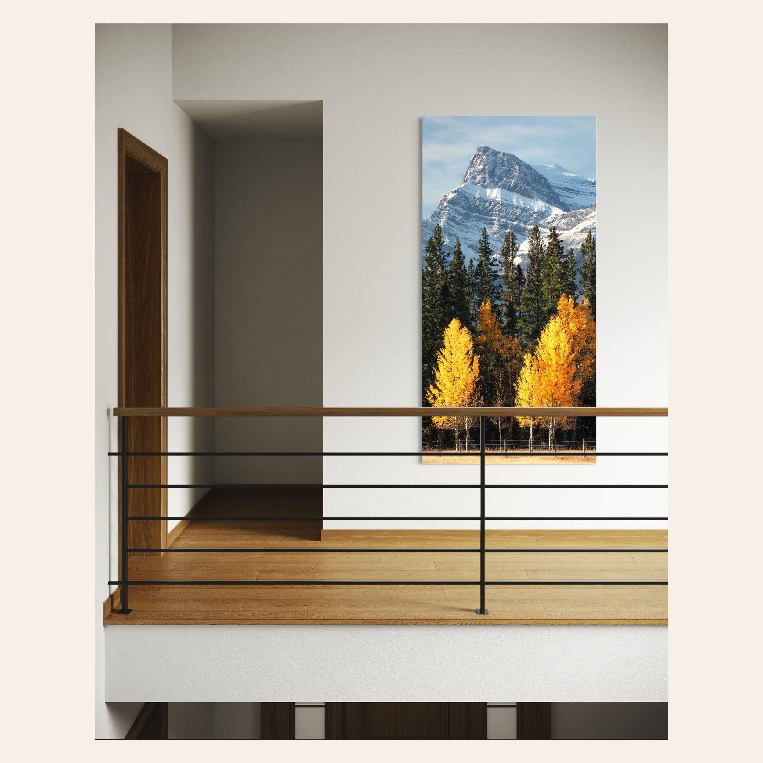 A piece of Banff wall art showing fall color photography hangs in a hallway.