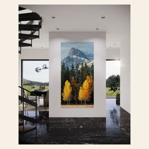 A piece of Banff wall art showing fall color photography hangs in a foyer.