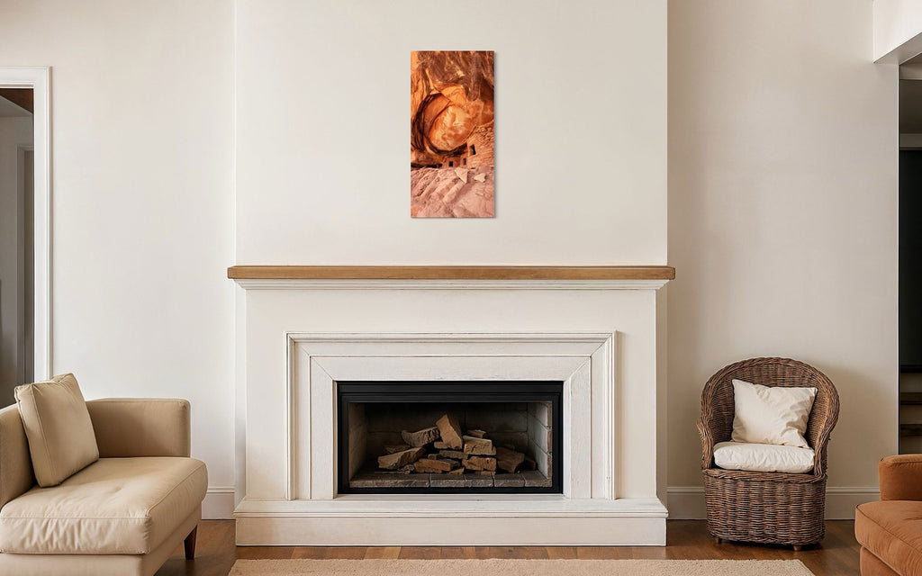 A piece of Southwest art showing a photo of an Anasazi dwelling in Bears Ears National Monument hangs over a fireplace.