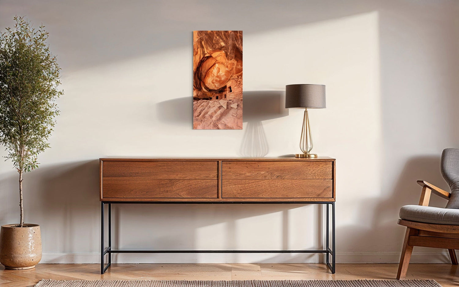 A piece of Southwest art showing a photo of an Anasazi dwelling in Bears Ears National Monument hangs in a sitting area.