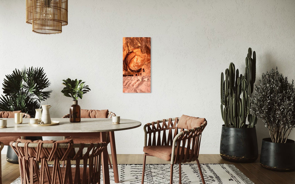 A piece of Southwest art showing a photo of an Anasazi dwelling in Bears Ears National Monument hangs in a dining room.