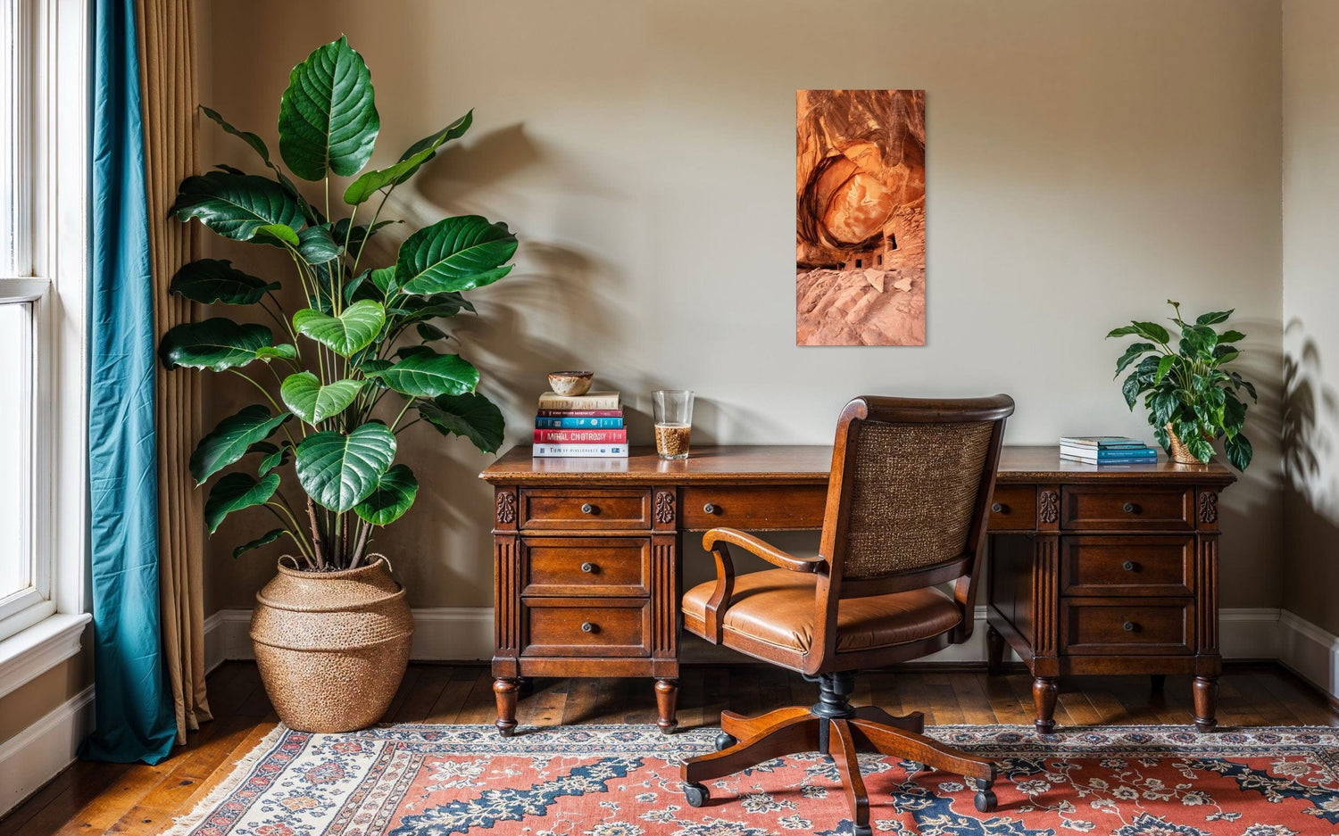A piece of Southwest art showing a photo of an Anasazi dwelling in Bears Ears National Monument hangs in an office.