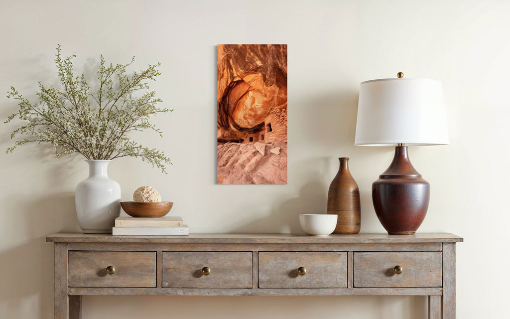 A piece of Southwest art showing a photo of an Anasazi dwelling in Bears Ears National Monument hangs in a home.