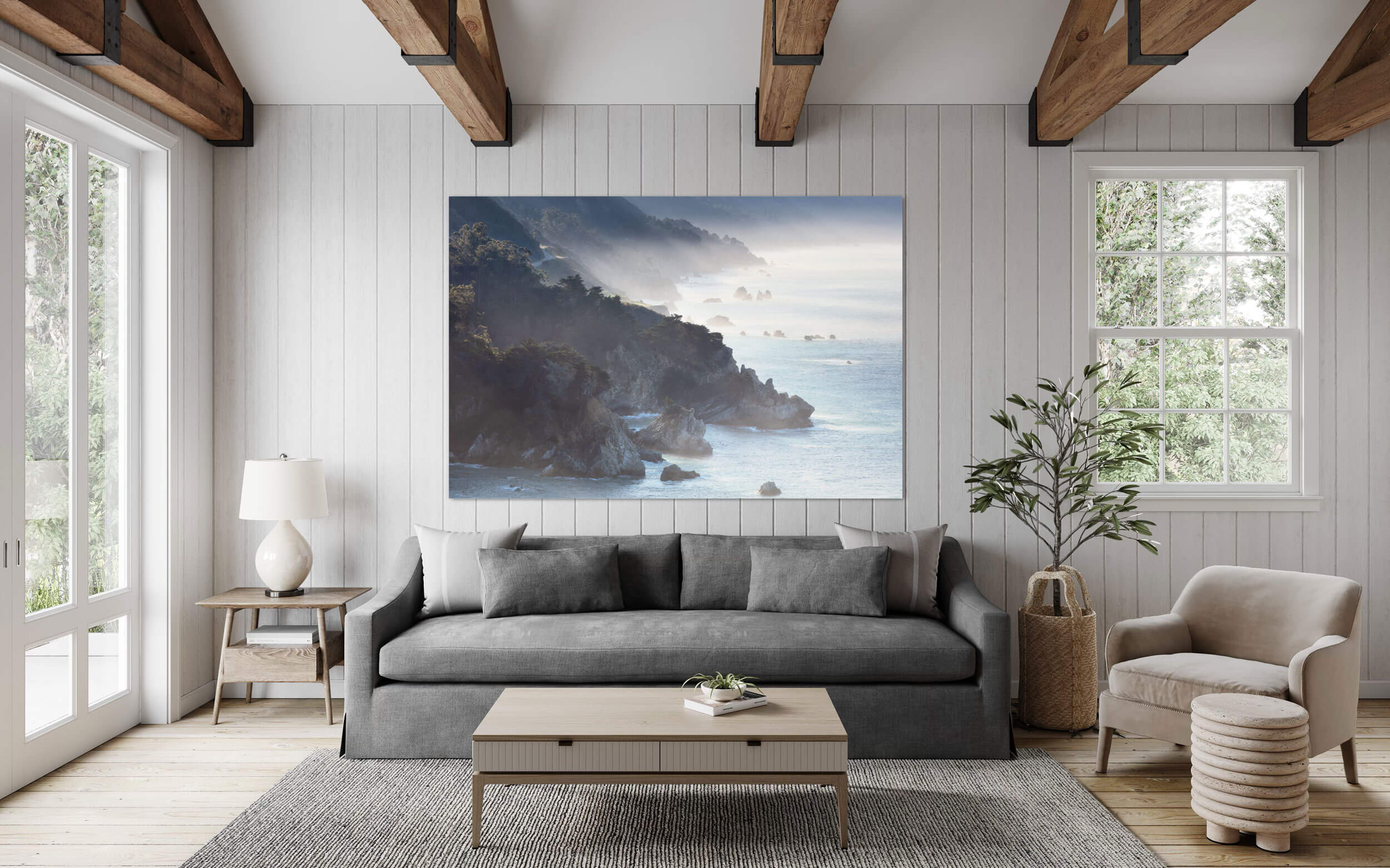 A Big Sur picture from California hangs in a living room.