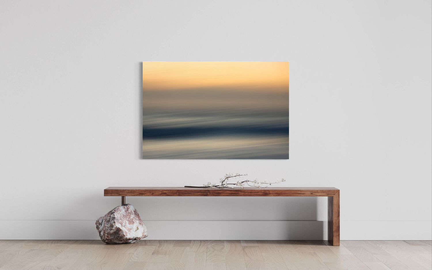 An abstract sunset picture photographed in Big Sur, California, hangs in a living room.
