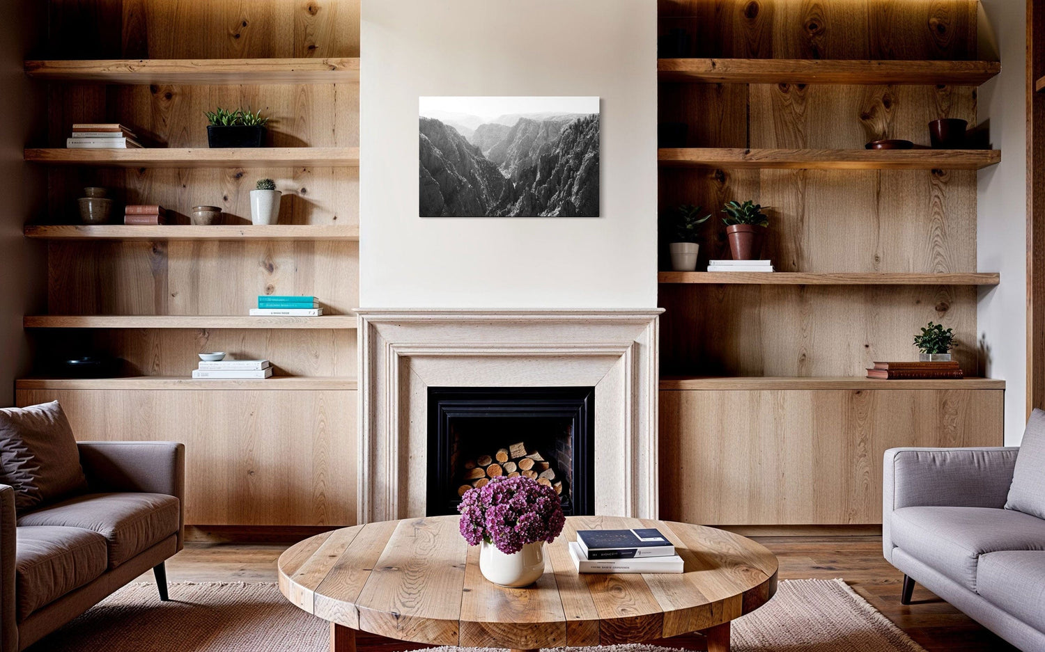 A piece of Colorado art showing a photo of the Black Canyon National Park in Gunnison hangs above a traditional fireplace.