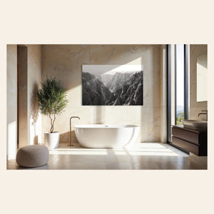 A piece of Colorado art showing a photo of the Black Canyon National Park in Gunnison hangs in a bathroom.