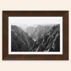 A piece of framed Colorado art shows a photo of the Black Canyon National Park in Gunnison.