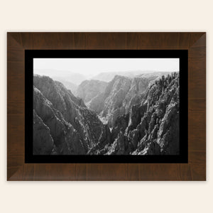 A piece of framed Colorado art shows a photo of the Black Canyon National Park in Gunnison.