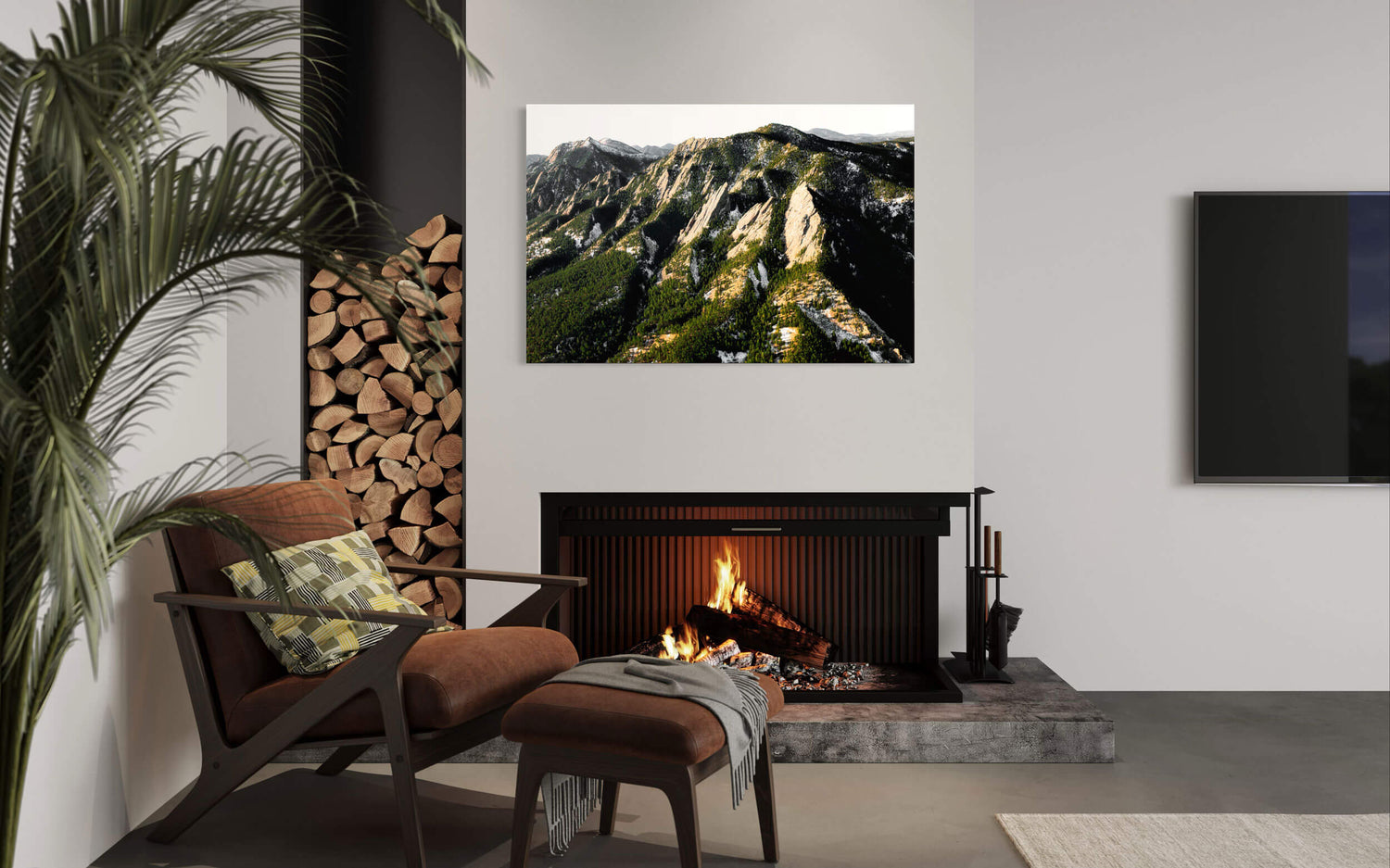 A Flatirons picture hangs in a living room as a piece of Boulder art.