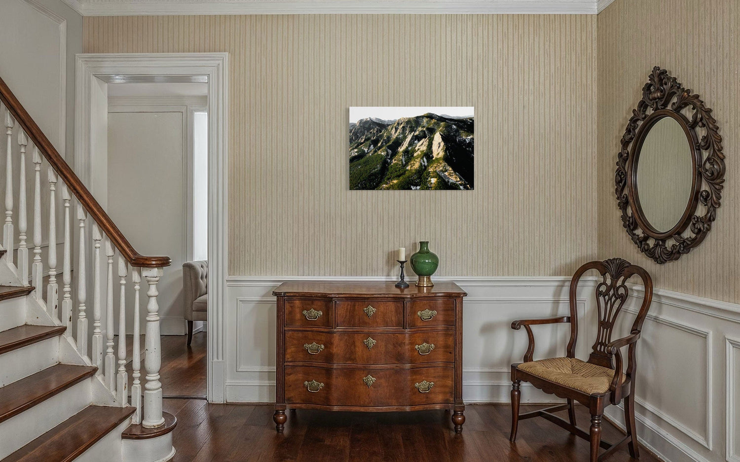 A piece of Boulder art showing an areal photo of the Flatirons along Colorado's Front Range hangs in a hallway.