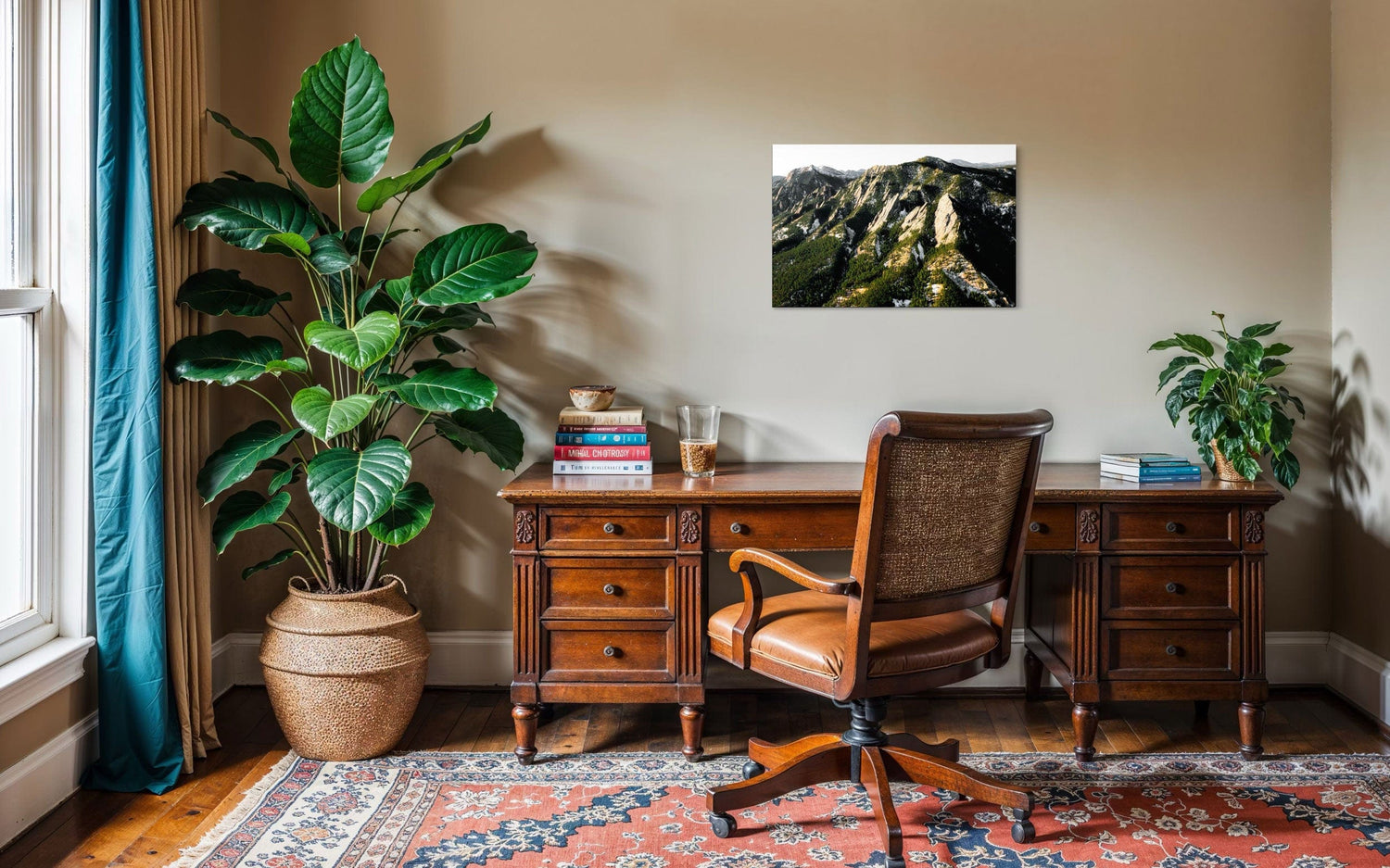 A piece of Boulder art showing an areal photo of the Flatirons along Colorado's Front Range hangs in an office.