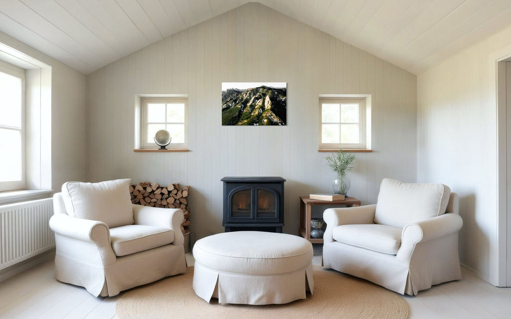 A piece of Boulder art showing an areal photo of the Flatirons along Colorado's Front Range hangs in a neutral living room.