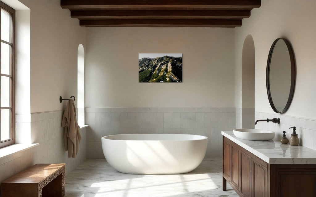 A piece of Boulder art showing an areal photo of the Flatirons along Colorado's Front Range hangs in a bathroom.