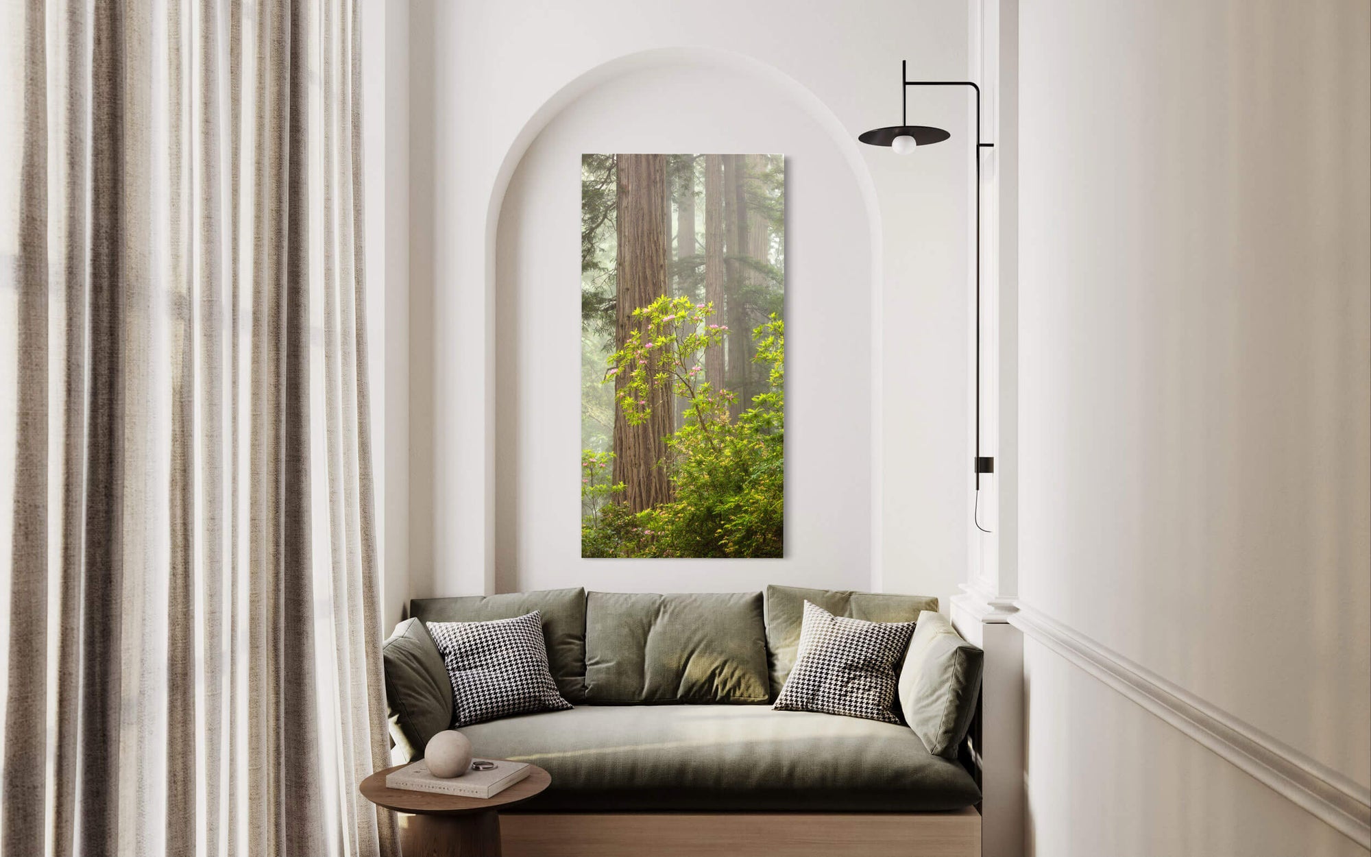 A California redwoods picture with rhododendron hangs in a living room.