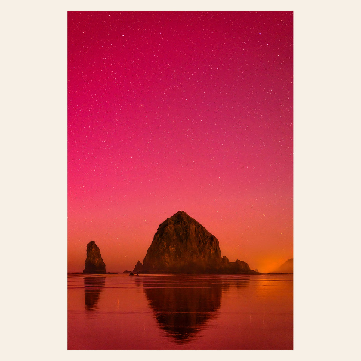A photo of the Northern Lights in Cannon Beach hangs in a dining room. | Lars Gesing Fine Art | Coastal Wall Art